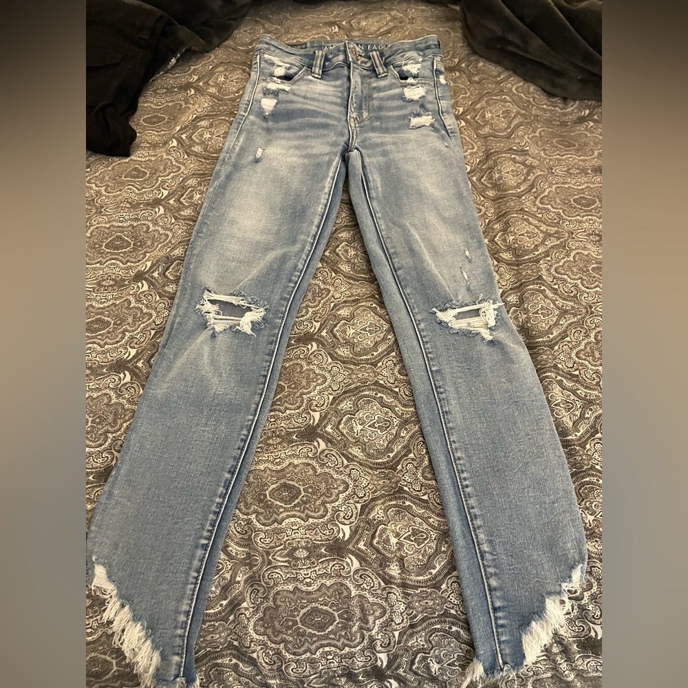 American Eagle hi-rise jegging crop next level stretch distressed jeans raw hem
